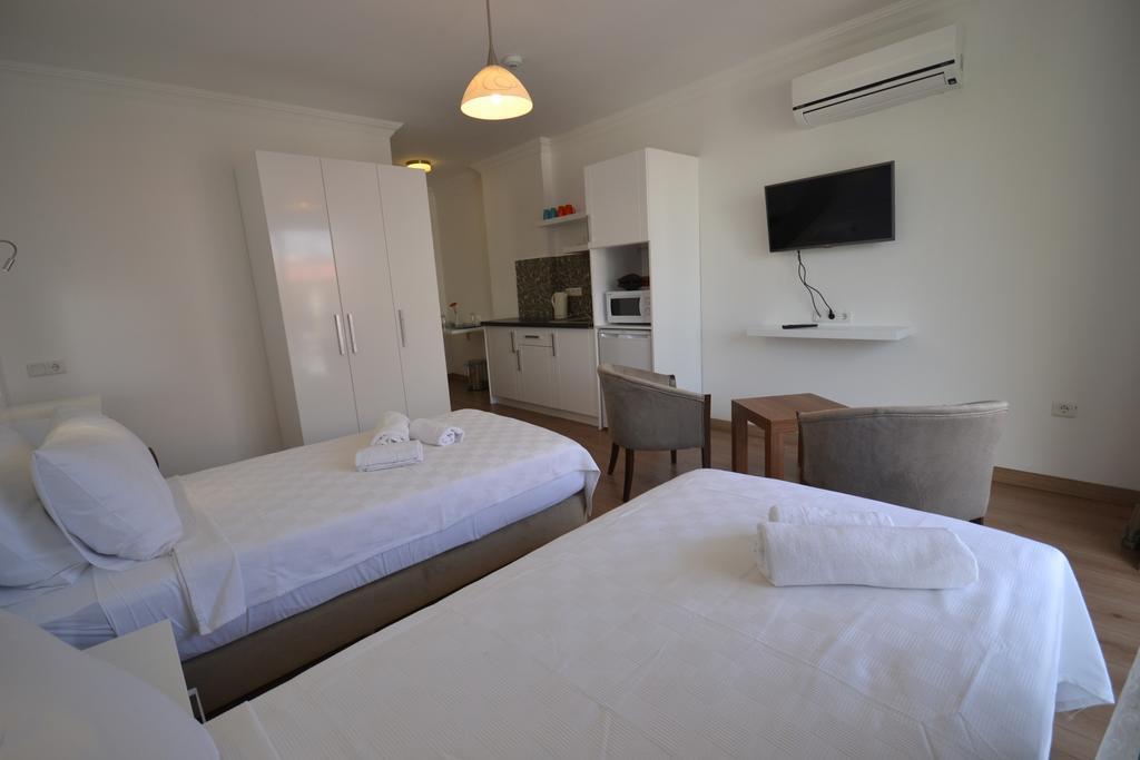 Kelebek Studio Apartments Kalkan Habitación foto